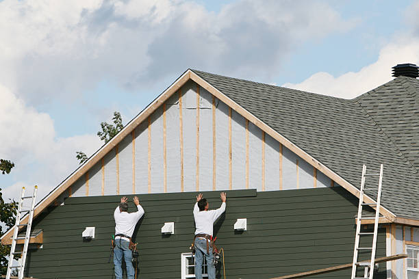 Professional Siding technician working in Terryville, NY